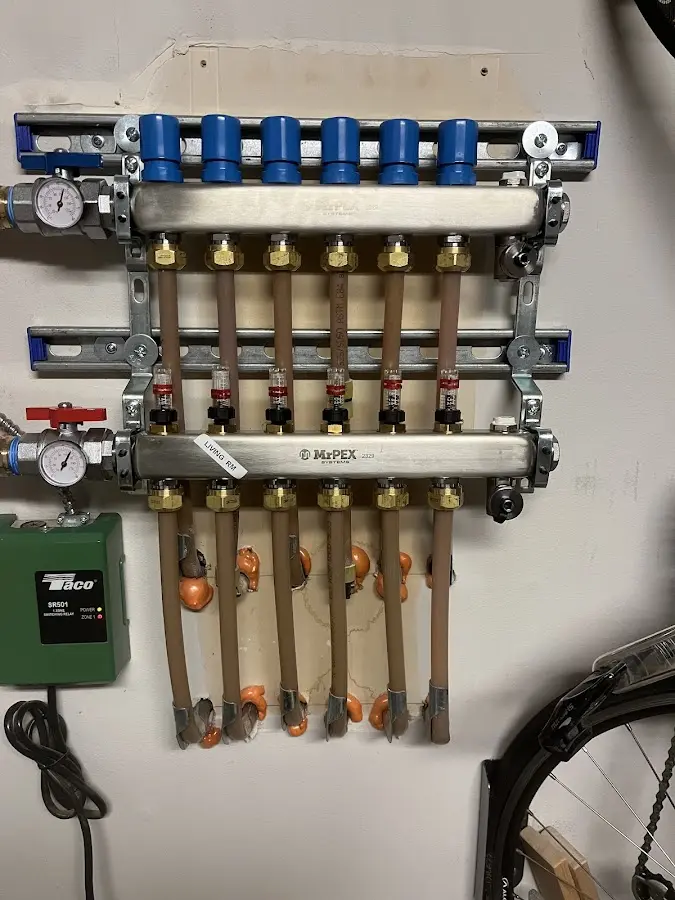 Plumber performing Leak Detection at a residential property in Pine Manor